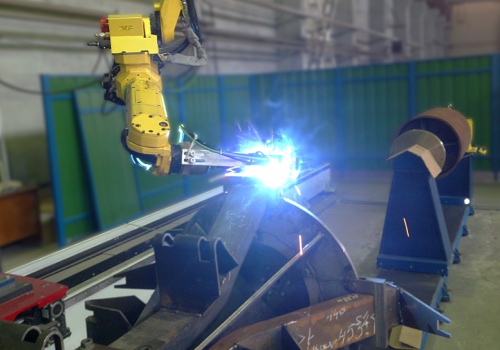 Konvejerių ritinėlių atramų suvirinimo robotas