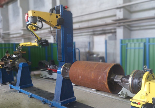 Konvejerių ritinėlių atramų suvirinimo robotas