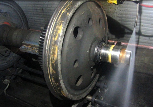 Vagonų ratų porų plovimo robotas