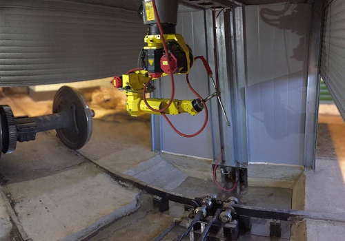 Vagonų ratų porų plovimo robotas