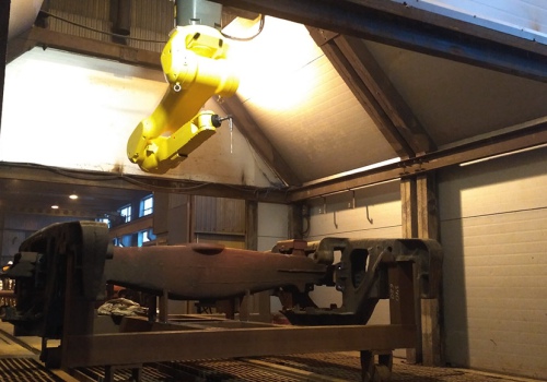 Krovininių vagonų vežimėlių plovimo robotas