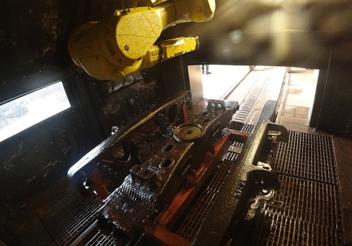 Krovininių vagonų vežimėlių plovimo robotas