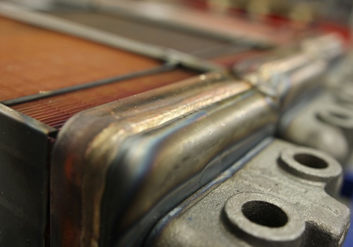 Radiatorių litavimo robotas