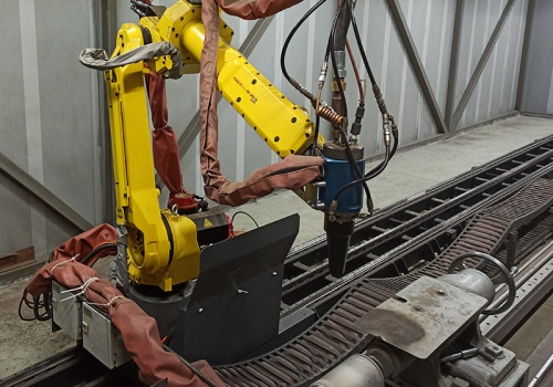 Velenų liepsninio užpurškimo robotas