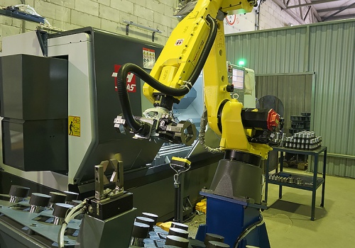 Mechaninio apdirbimo centro pakrovimo robotas